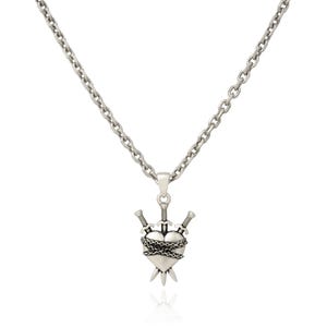 Silver heart pendant with 3 swords going through it and wrapped in chain on white background