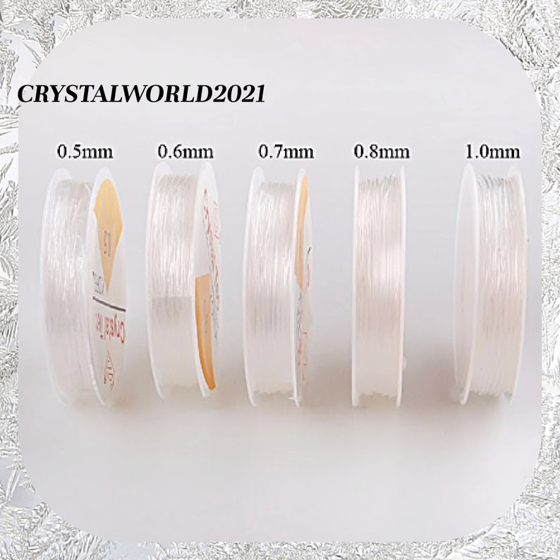 May include: Five spools of clear elastic string in different sizes: 0.5mm, 0.6mm, 0.7mm, 0.8mm, and 1.0mm. The spools are labeled with the size of the string.