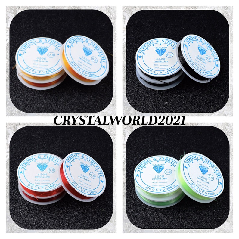 May include: Four spools of elastic string for jewelry making. The spools are labeled "Strong & Stretchy" and have a diamond logo. The spools are in the colors yellow, black, red, and green.
