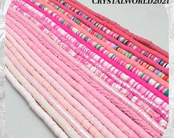 May include: A collection of pink and white polymer clay beads in various shapes and sizes. The beads are arranged in rows, creating a colorful and visually appealing display.  CRYSTALWORLD2021 is printed in the top right corner of the image.