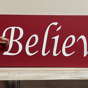 Believe wooden sign