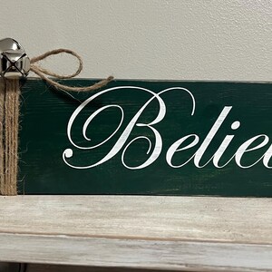 Believe wooden sign with bells