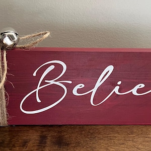 Believe wooden sign with bells
