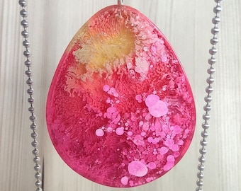 Great, drop-shaped epoxy pendant in bright pink on a ball chain