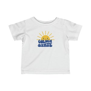 Dress your little champion in adorable style with our Baby Golden State Warriors Shirt!