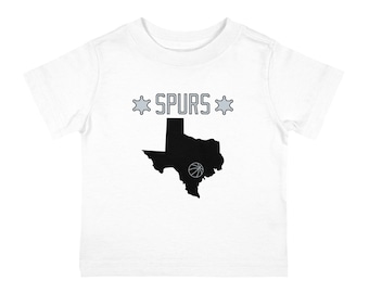 Wprowadź swoją pociechę w rytm zwycięstwa z naszą koszulką Baby San Antonio Spurs!