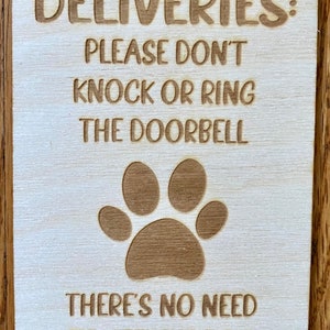 Deliveries don’t knock or ring the doorbell, there’s no need to get the dog involved hanging sign