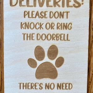 Deliveries don’t knock or ring the doorbell, there’s no need to get the dog involved hanging sign