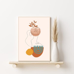 K&ouml;nnte beinhalten: Abstrakter Linienkunst-Druck mit einem Gesicht, Bl&auml;ttern und geometrischen Formen in Braun-, Orange- und T&uuml;rkist&ouml;nen. Der Hintergrund ist in einem hellen Pfirsichton gehalten.