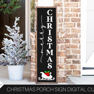 May include: Black wooden sign with white text that reads "Merry Christmas" and a red and white Santa sleigh with a gift. The sign is hanging on a brick wall.