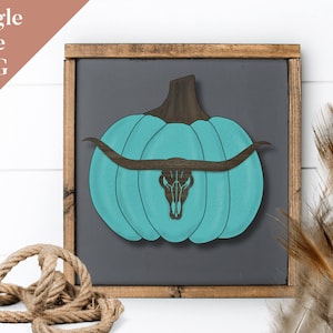 May include: A teal blue pumpkin with a brown stem and a single line drawing of a longhorn skull with horns extending out from the pumpkin.