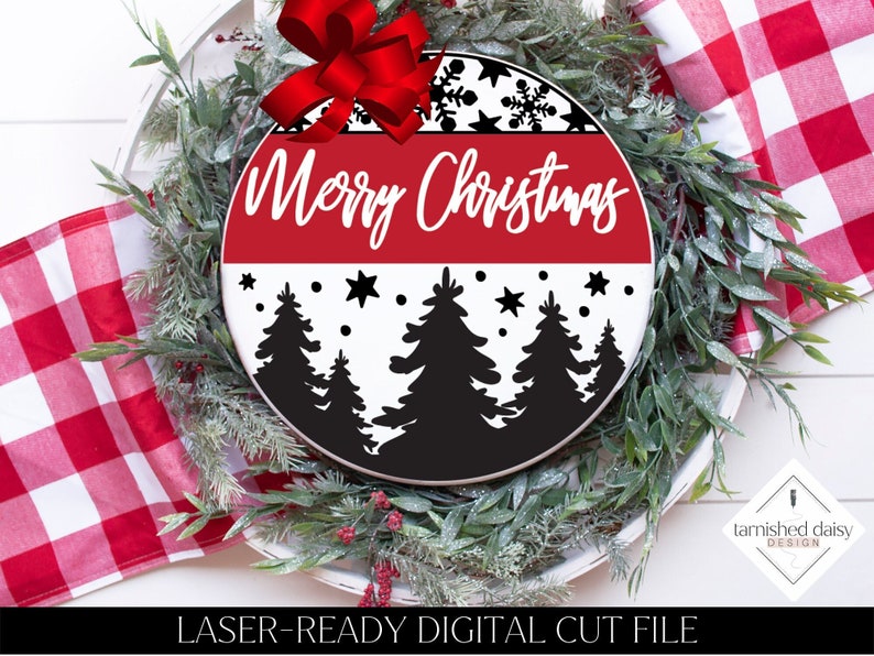 May include: A round, black and white Christmas sign with a red band that says "Merry Christmas". The sign features a snowy forest scene with black silhouette trees and white snowflakes.