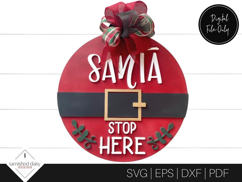 May include: Red and white Santa Claus door hanger with a black belt and the words "Santa Stop Here" in white lettering. The door hanger is decorated with a green and red bow.