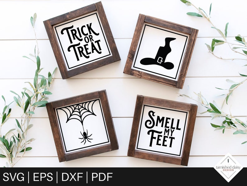 May include: Four wooden signs with black text and graphics. The signs read "Trick or Treat", "Smell My Feet", and feature a witch's hat and a spider web with a spider.