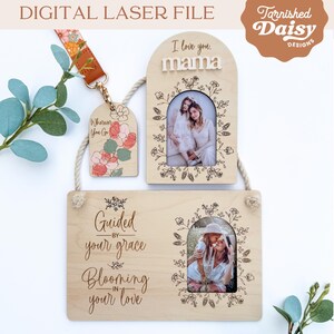 May include: A set of three wooden photo frames with a floral design. The frames are engraved with the text "I love you, mama", "Guided by your grace, Blooming in your love", and "Wherever you go".