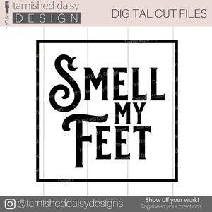 May include: A black and white digital cut file design that says "Smell My Feet" in a decorative font.