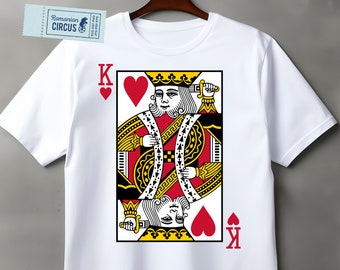 May include: White t-shirt with a red and black playing card graphic of the King of Hearts. The card features a red heart, a yellow crown, and a yellow and black design.