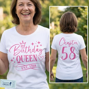 May include: White t-shirt with pink text reading "Birthday QUEEN EST. 1968" on the front and "Chapter 58" on the back. The design includes a crown, stars, and a heart. The shirt is worn by a person.
