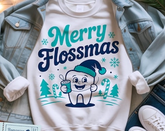 May include: White sweatshirt with the text "Merry Flossmas" in teal and navy blue, featuring a cartoon tooth wearing a teal hat and holding a floss container. The design includes snowflakes, candy canes, and Christmas trees.