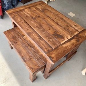 Handmade wooden table with bench seats