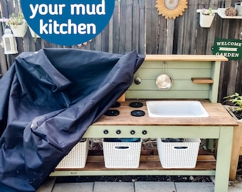 May include: A wooden mud kitchen with a black cover, white sink, and stove top. The kitchen has a light green frame, white storage baskets, and the text "Protect your mud kitchen".