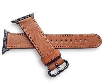 May include: A brown leather watch strap with a black metal buckle. The strap is designed for an Apple Watch.
