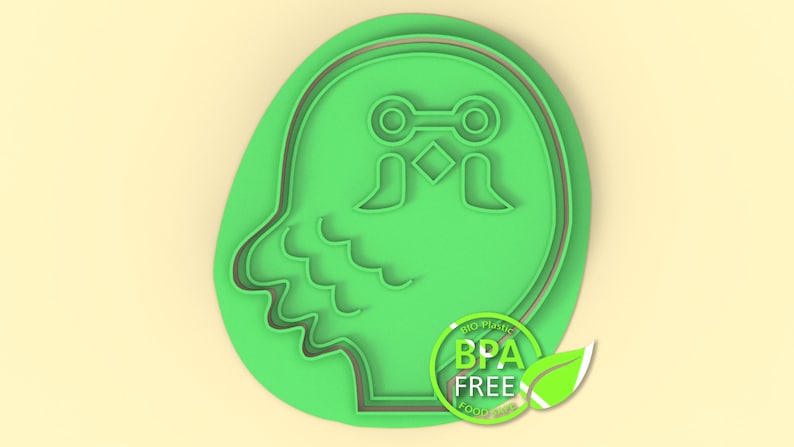 K&ouml;nnte beinhalten: Gr&uuml;ner Plastik-Ausstecher in Form eines Eulenkopfes mit gro&szlig;en Augen und einem Schnabel. Der Ausstecher hat eine doppelte Umrandung und die Worte "BPA FREE" sind auf einem gr&uuml;nen Kreis mit einem Blatt aufgedruckt.