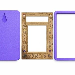 May include: A three-part set comprising a purple backing with a keyhole, a wooden frame with etched symbols and a white centre, and a purple frame. The wooden frame has a rectangular opening.