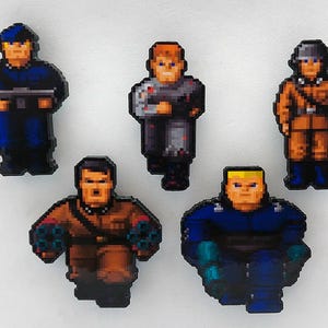 May include: Five pixel art style figurines of soldiers in different poses and outfits. The figurines are made of plastic and have a glossy finish.