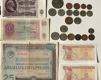 May include: A collection of vintage Soviet and Ukrainian currency, including paper money and coins. The paper money features images of Lenin and a Soviet emblem. The coins are in various denominations and feature different designs.