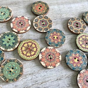 May include: Assortment of colorful wooden buttons with intricate mandala designs. The buttons are round and have two holes.