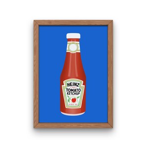 May include: A framed illustration of a red glass bottle of Heinz Tomato Ketchup on a blue background. The bottle has a white cap and a yellow label with the Heinz logo and the words "Tomato Ketchup".