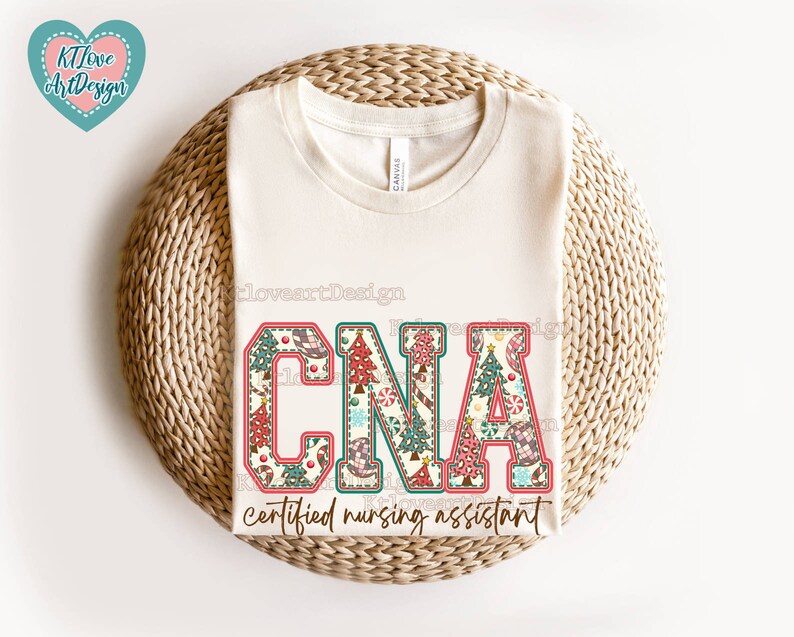 May include: A white t-shirt featuring a Christmas-themed design that reads "CNA certified nursing assistant". The letters are decorated with candy canes, baubles, and Christmas trees.