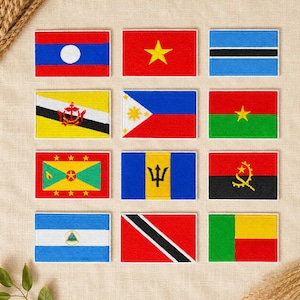 May include: A collection of twelve rectangular embroidered patches featuring various national flags, including Laos, Vietnam, Botswana, Brunei, Philippines, Burkina Faso, Grenada, Barbados, Angola, Nicaragua, Trinidad and Tobago, and Benin.