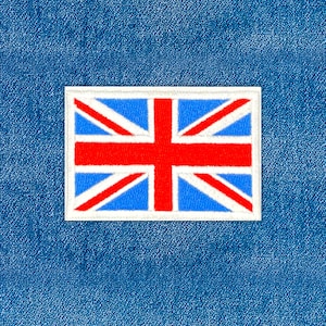 May include: A rectangular patch featuring the Union Jack, the national flag of the United Kingdom. The patch has a white border, a blue background, and red and white cross designs. The patch is set against a blue denim background.