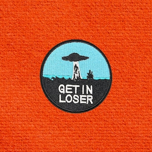 May include: A rustic wooden sign with the text "Welcome to our home" in white lettering. The sign features a distressed finish and a simple, inviting design, perfect for entryway decor.