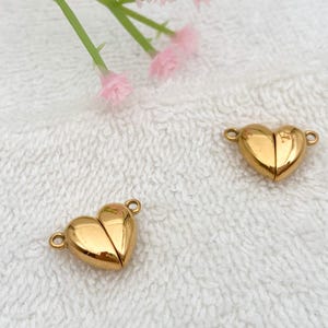 May include: Two gold-toned heart-shaped magnetic clasps for jewelry making.