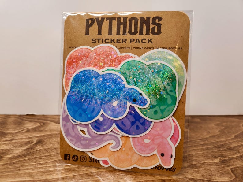 May include: A sticker pack featuring colorful python designs. The stickers are in various colors, including blue, green, pink, and orange, with glitter accents. The packaging is a brown card with the text "PYTHONS STICKER PACK".