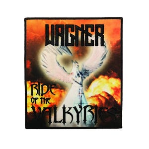 May include: A rectangular embroidered patch featuring a fiery orange and red cloud background. The text WAGNER appears at the top, and RIDE OF THE VALKYRIES is at the bottom in black lettering. A central figure with large white wings is visible.