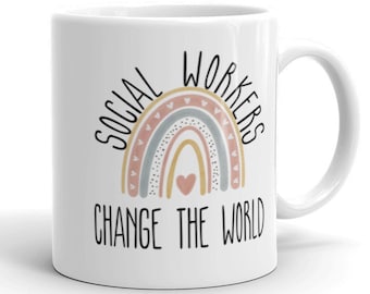 May include: White ceramic coffee mug with a rainbow design and the text "Social Workers Change The World".