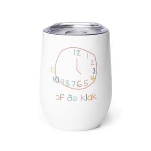 May include: White stainless steel tumbler with a colorful clock design and the text "of öä klak" printed on the front.
