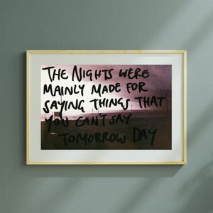 May include: A framed print with a pink and purple background featuring a handwritten quote that reads "The nights were mainly made for saying things that you can't say tomorrow day."