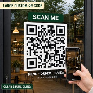 May include: A clear static cling featuring a large black and white QR code on a white background. Above the code is a dark green rectangle with the white text SCAN ME. Below the code, the text reads MENU • ORDER • REVIEW and YOUR CUSTOM LINK.