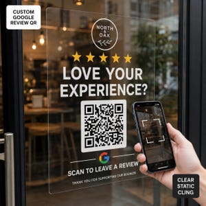 May include: A clear static cling window decal featuring the North & Oak logo, five yellow stars, and the text LOVE YOUR EXPERIENCE? above a large QR code. Below the code, the Google logo appears with the text SCAN TO LEAVE A REVIEW.