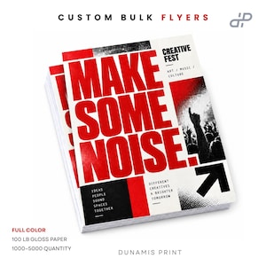 May include: A stack of custom bulk flyers featuring the bold red text MAKE SOME NOISE. The design includes black and white graphics of a crowd, the text CREATIVE FEST ART MUSIC CULTURE, and the words IDEAS PEOPLE SOUND SPACES TOGETHER.