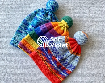 Handgebreide wollen muts met pompons: babymutsje voor peuters