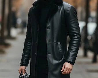 May include: Black leather long coat with a faux fur collar. The coat has a button-down closure, side pockets, and a tailored fit. A black briefcase is held in the hand. The coat is a classic outerwear piece.