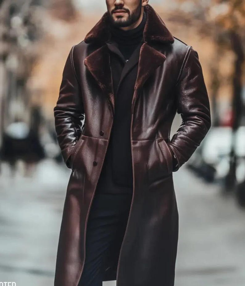 May include: A long, dark brown leather coat with a faux fur collar. The coat has a double-breasted design and pockets. The person is wearing a black turtleneck and black pants. The coat appears to be knee-length.