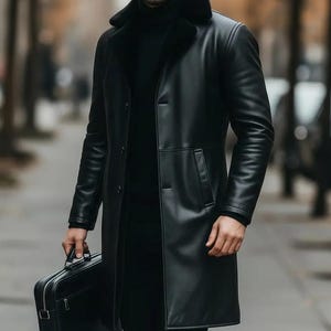 May include: A long, black leather coat with a faux fur collar. The coat has a button-down front and pockets. A black briefcase is held in the hand. The coat appears to be worn in an outdoor setting.
