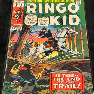 May include: A vintage comic book cover featuring a cowboy riding a white horse. The cover is titled "The Ringo Kid" and features the text "Is This-- The End of the Trail!" in red and white.